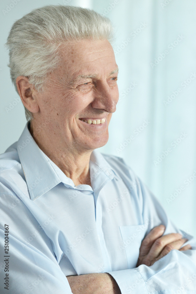 Portrait of a smiling senior man posing Portrait of a smiling senior man posing