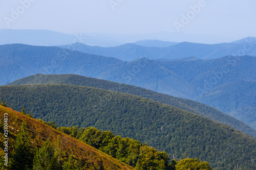 green mountain chains in blue mist