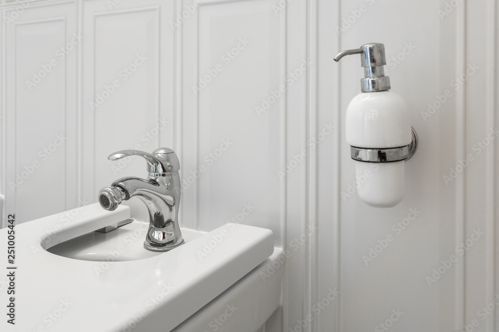 Fototapeta premium toilet and detail of a corner shower bidet with soap and shampoo dispensers on wall mount shower attachment