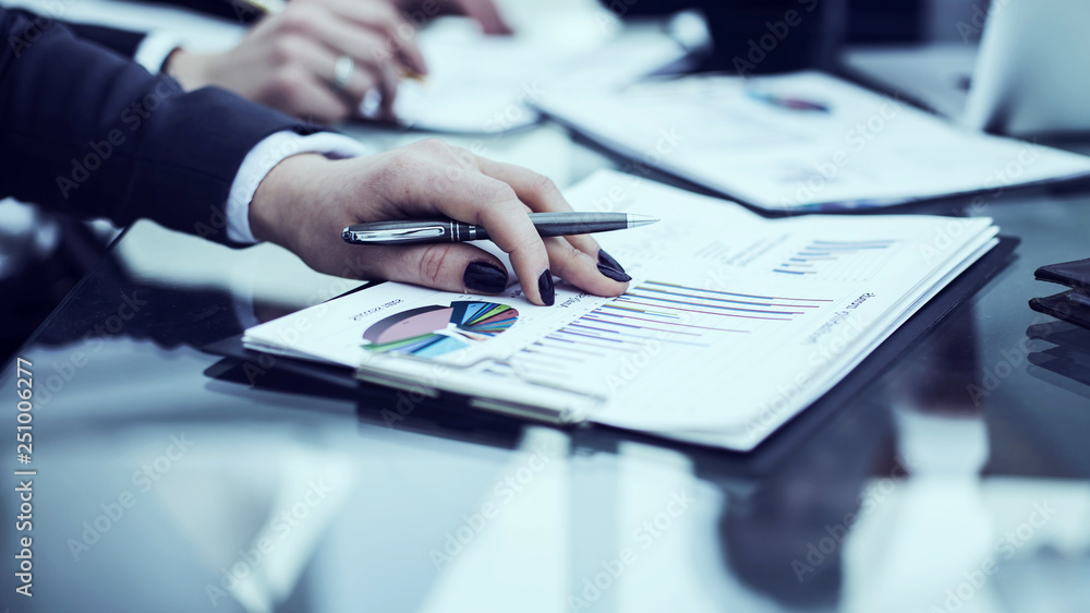 business team discussing financial charts on a workplace business team discussing financial charts on a workplace