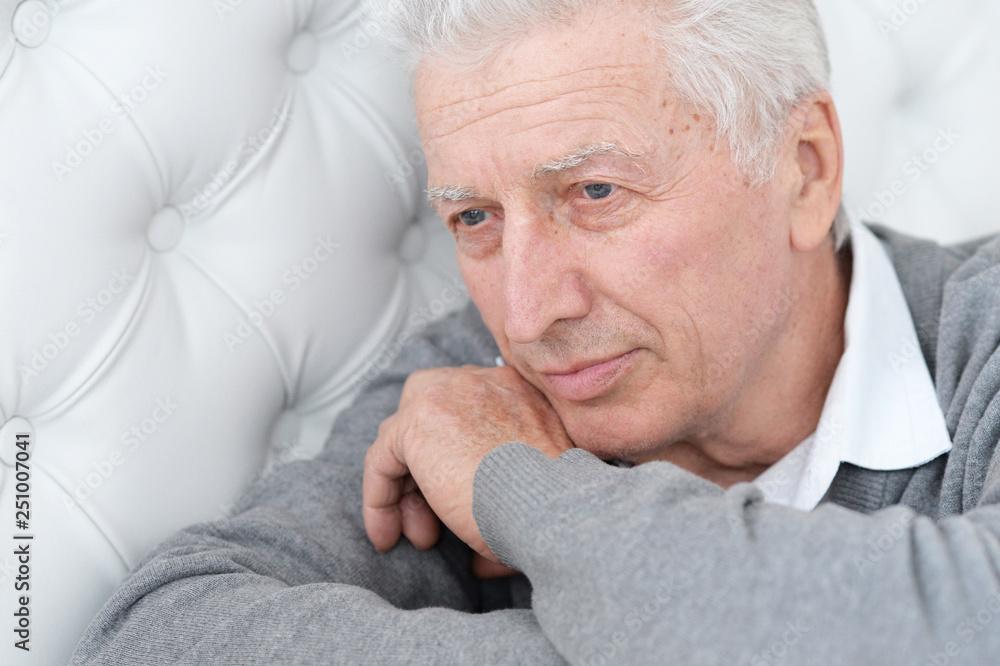 Close up portrait of thoughtful senior man posing Close up portrait of thoughtful senior man posing