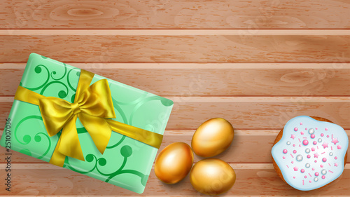 Realistic golden Easter eggs, tasty cake and beautiful gift box with bow on wooden planks