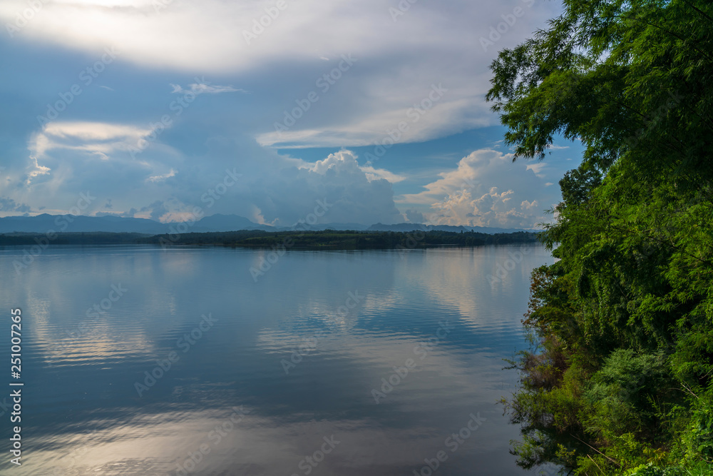 Blue sky high peak mountains fog hills mist scenery river lake dam bay gulf wildlife  National park views Kanchanabur, Thailand.