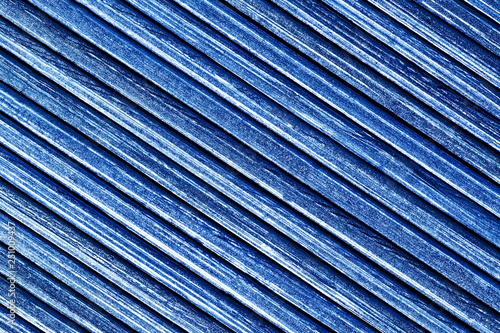 Striped wooden lines pattern. Grunge blue paint wood backdrop.