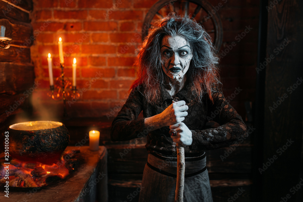 Scary witch on spiritual seance, cooking
