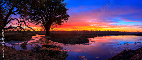 Colorful sunrise with reflection from lake
