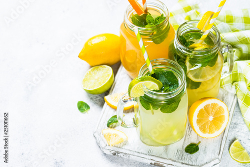 Lemonade, mojito and orange lemonade on white.