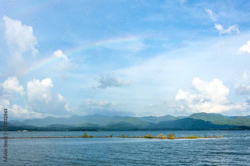 rainbow on sky landscape river view