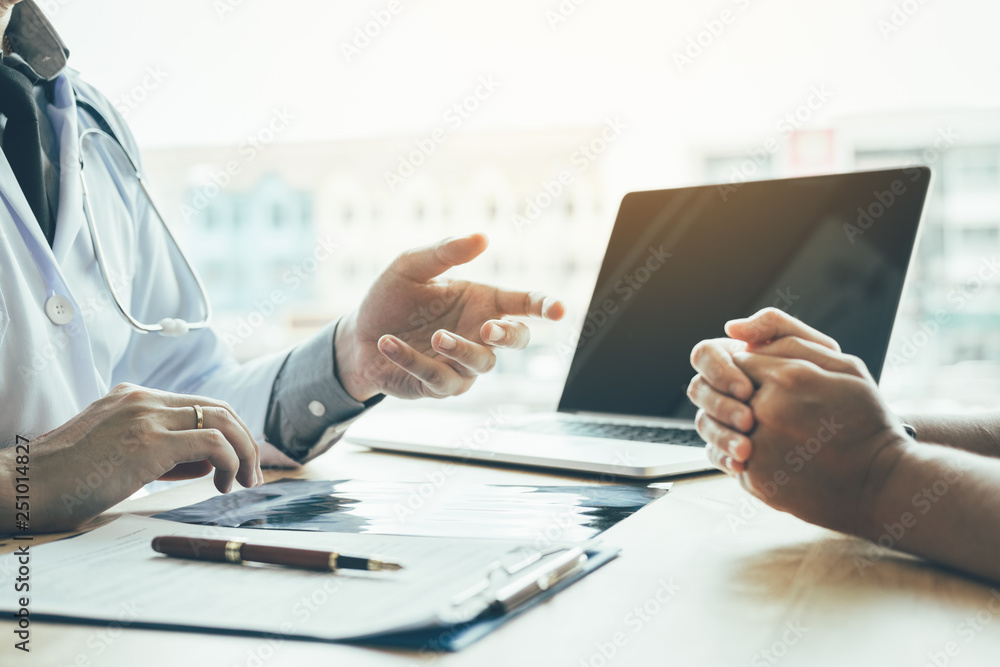 Doctor hand holding pen and talking to the patient about medication and treatment. Doctor hand holding pen and talking to the patient about medication and treatment.