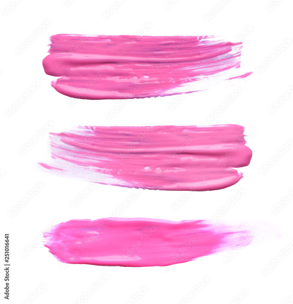 Set with abstract brushstrokes of pink paint on white background, top view Set with abstract brushstrokes of pink paint on white background, top view