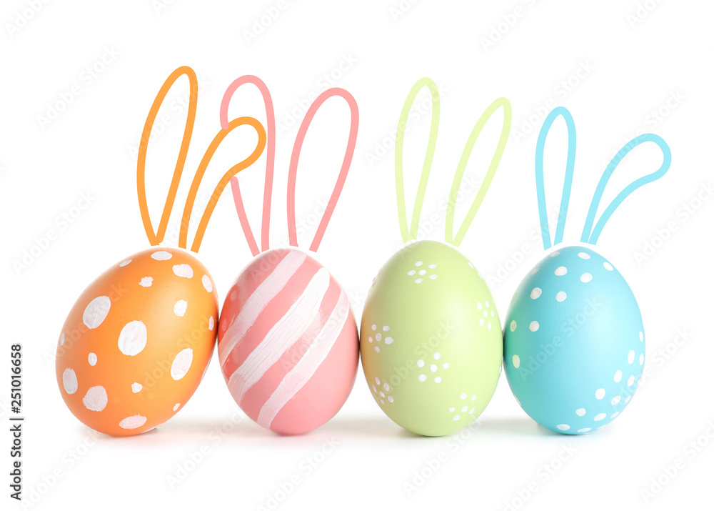 Set of colorful eggs with Easter bunny ears on white background Set of colorful eggs with Easter bunny ears on white background