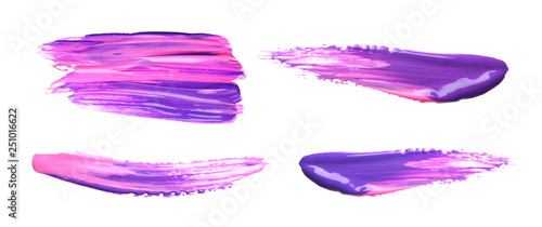 Set with abstract brushstrokes of bright paints on white background, top view
