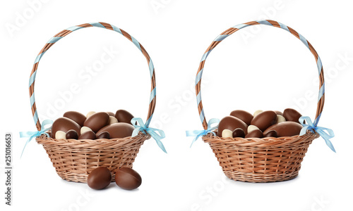 Set of wicker baskets with delicious chocolate Easter eggs on white background