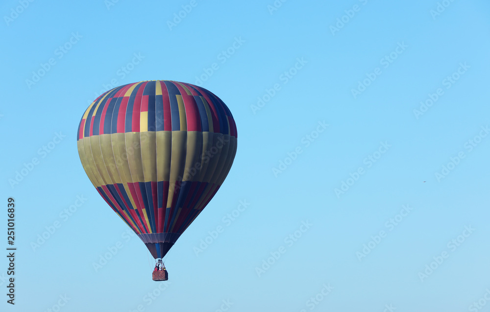 Beautiful view of hot air balloon in blue sky. Space for text Beautiful view of hot air balloon in blue sky. Space for text