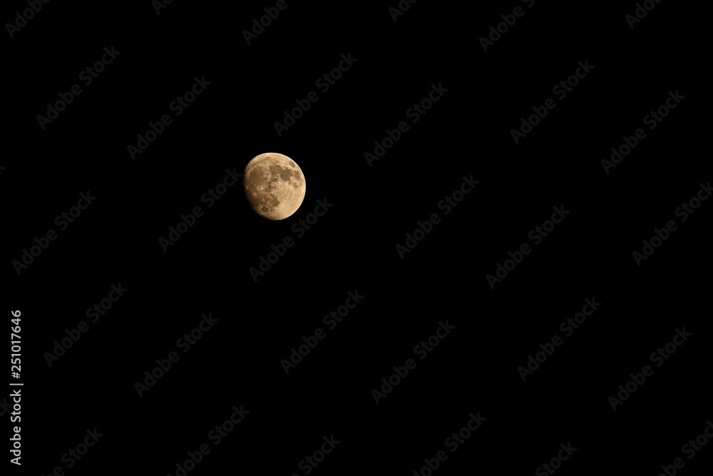 Full moon over dark black sky at night Full moon over dark black sky at night