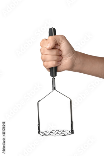 Canvas Print Woman holding potato masher on white background. Kitchen utensils