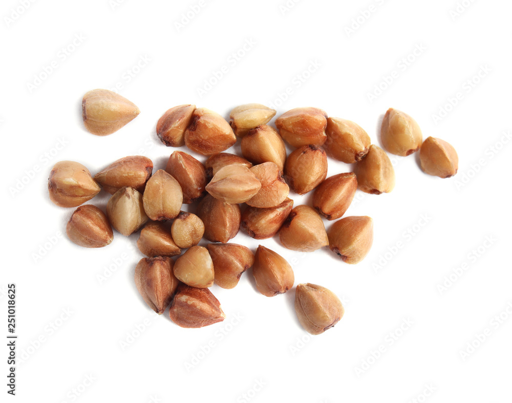 Uncooked buckwheat on white background, top view Uncooked buckwheat on white background, top view