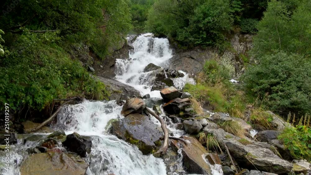 View waterfall scenes in mountains, national park Dombai, Caucasus, Russia. Summer landscape, sunshine weather and sunny day View waterfall scenes in mountains, national park Dombai, Caucasus, Russia. Summer landscape, sunshine weather and sunny day