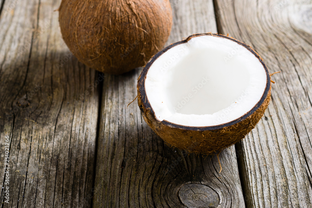 coconuts on natural old wood table background coconuts on natural old wood table background