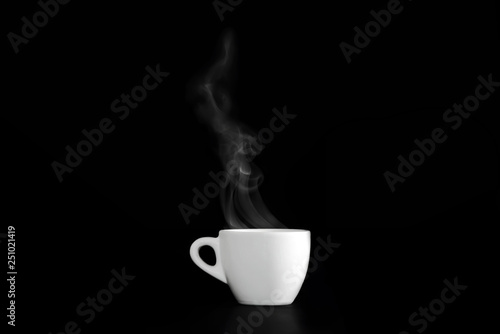 Hot espresso coffee in white porcelain cup on black background