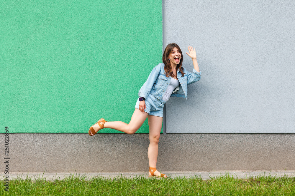 Φωτογραφία Full length portrait of happy excited beautiful woman in casual jeans denim styl