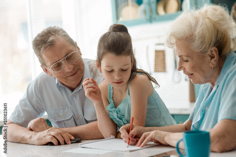 Obraz premium Granny helps a grandaughter