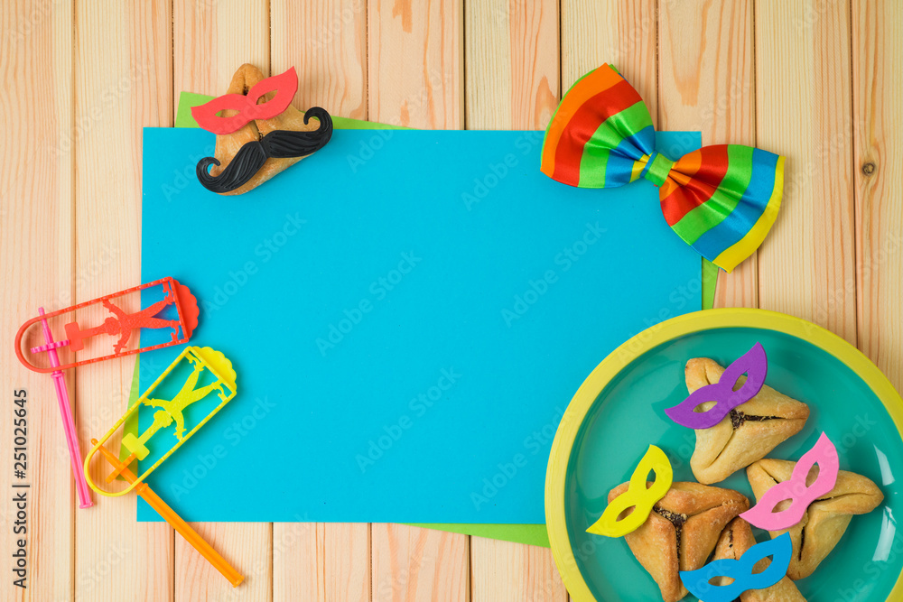 Jewish holiday Purim background with cute funny hamantaschen cookies and  paper note on wooden table. Stock Photo | Adobe Stock
