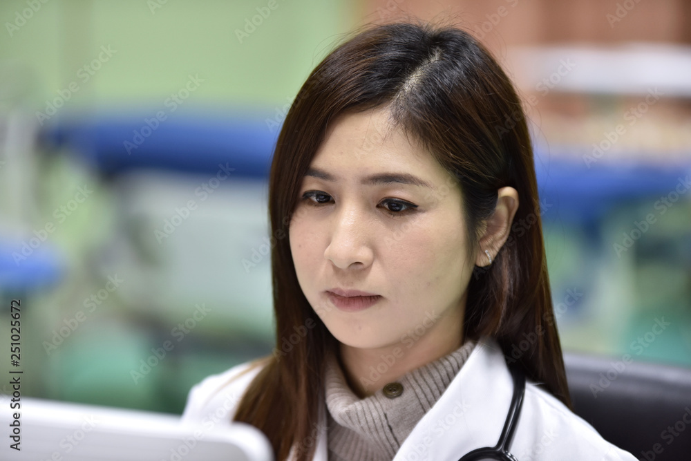 Portrait of a beautiful young doctor in a hospital work suit Portrait of a beautiful young doctor in a work suit at the hospital is Portrait of a beautiful young doctor in a hospital work suit Portrait of a beautiful young doctor in a work suit at the hospital is