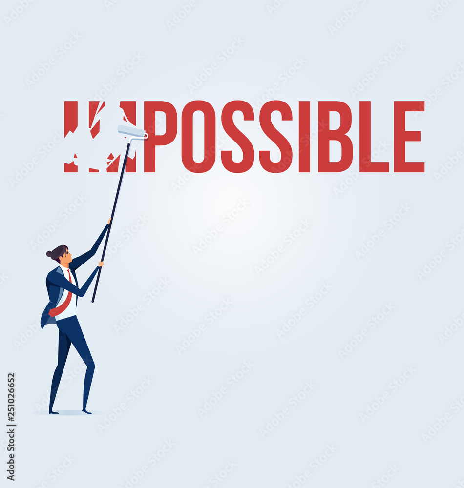 Businessman turning the word Impossible into Possible Businessman turning the word Impossible into Possible
