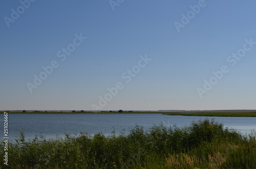 landscape with lake and blue sky © Юлия Жевлакова
