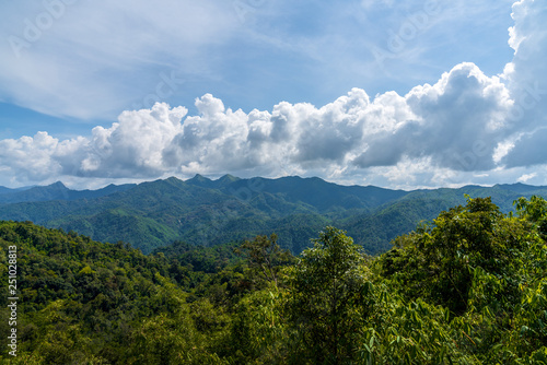 Blue sky high peak mountains fog hills mist scenery river lake dam bay gulf wildlife National park views Kanchanabur, Thailand.