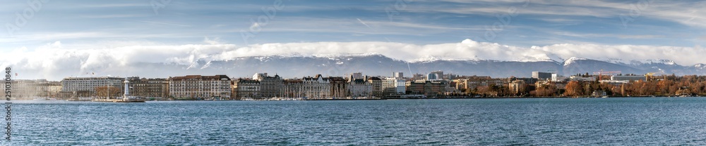 View on Geneva Lake from Quai de Cologny with Phare des Paquis on the left, Geneva, Switzerland, December 2019. Lake on the north side of the Alps, shared between Switzerland and France