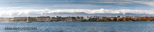 View on Geneva Lake from Quai de Cologny with Phare des Paquis on the left, Geneva, Switzerland, December 2019. Lake on the north side of the Alps, shared between Switzerland and France © cubrick