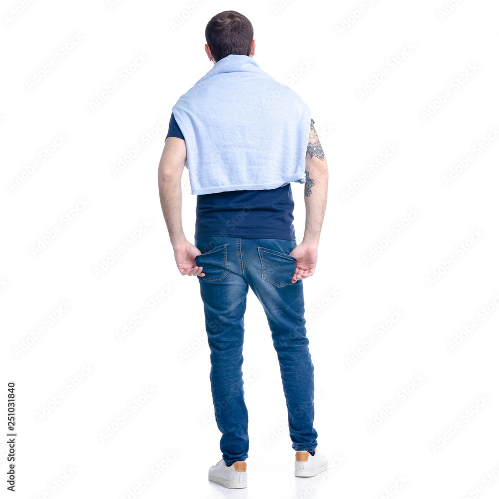 Man in jeans standing on white background isolation, back view Man in jeans standing on white background isolation, back view