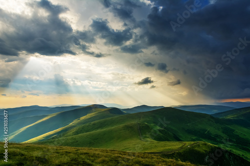 Summer in the Carpathian massif of Swidovets  located in Ukraine  with a lot of lakes  green pasture for sheep and horses  and wonderful  after a stormy sky with a rainbow.