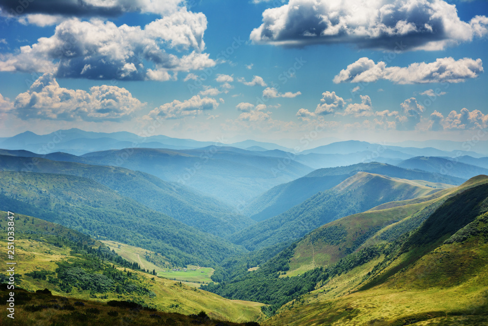 Obraz premium Summer in the Carpathian massif of Swidovets, located in Ukraine, with a lot of lakes, green pasture for sheep and horses, and wonderful, after a stormy sky with a rainbow.