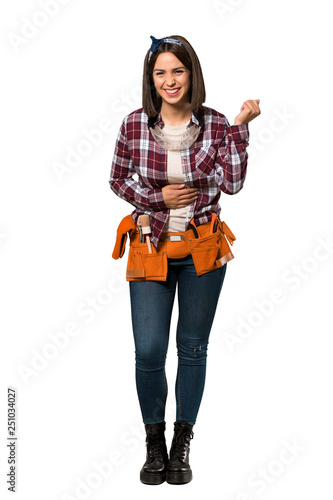 A full-length shot of a Young worker woman smiling a lot over isolated white background