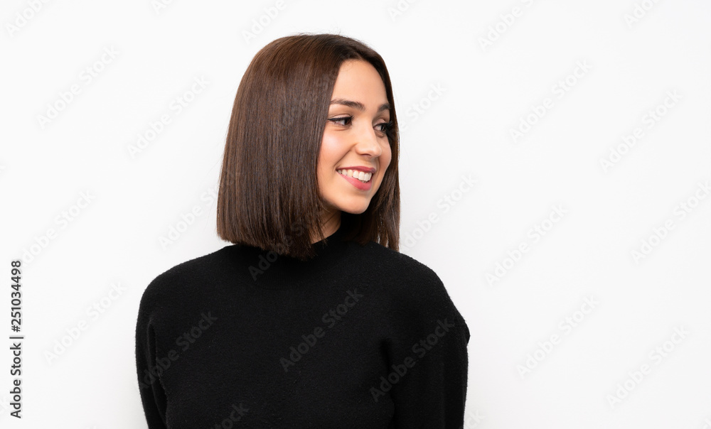 Portrait of young woman over white wall Portrait of young woman over white wall