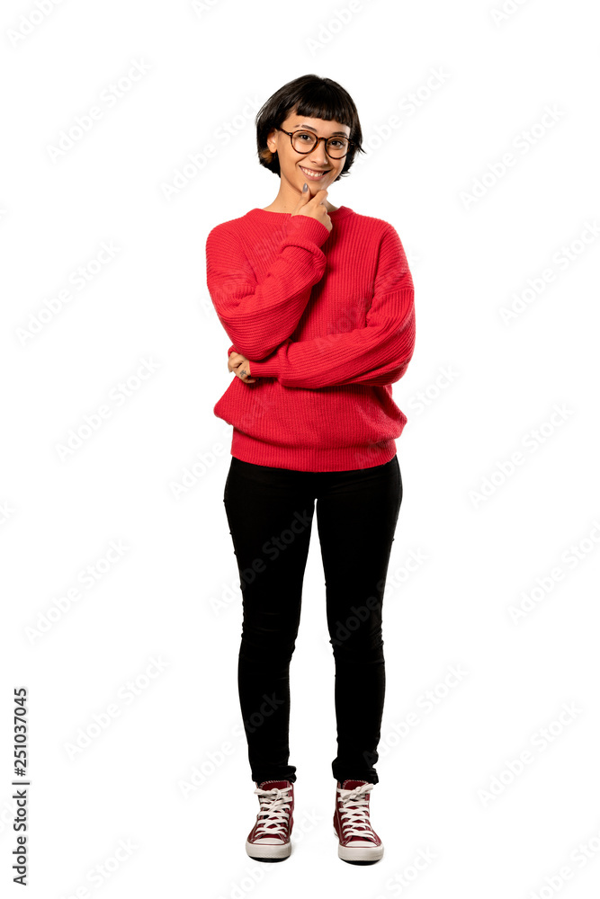 Fototapeta premium A full-length shot of a Short hair girl with red sweater with glasses and smiling over isolated white background