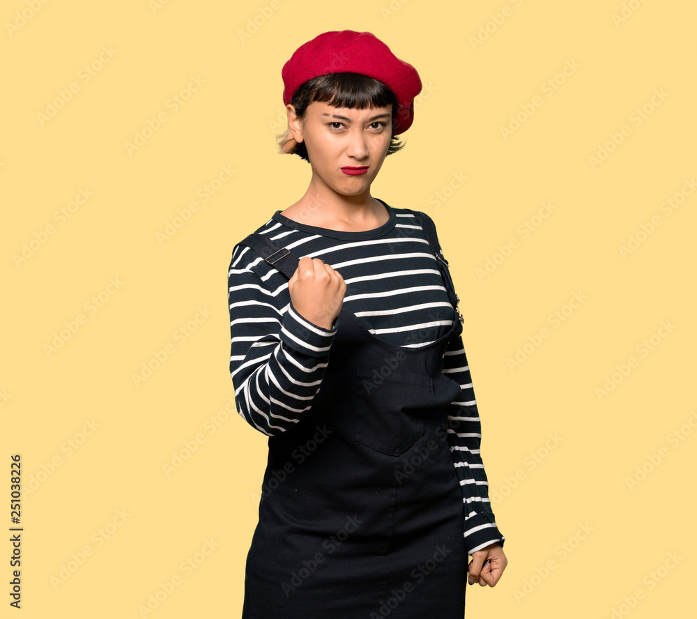 Young woman with beret with angry gesture Young woman with beret with angry gesture