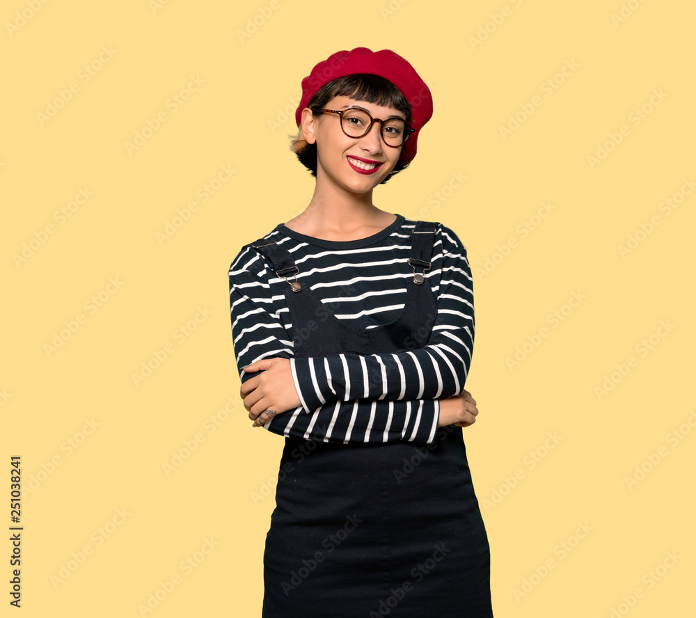 Young woman with beret with glasses and smiling Young woman with beret with glasses and smiling