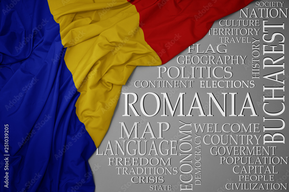 waving colorful national flag of romania on a gray background with important words about country