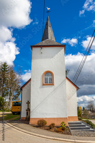 St. Briktiuskapelle or Chapel of St. Brice in Merlscheid, Belgium on a sunny April day photo