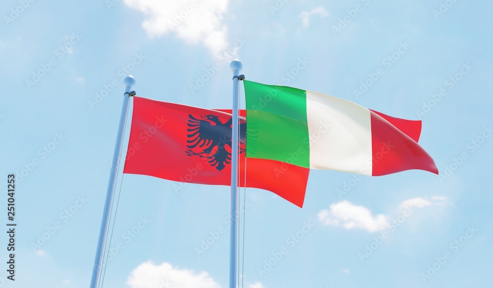 Italy and Albania, two flags waving against blue sky. 3d image Italy and Albania, two flags waving against blue sky. 3d image