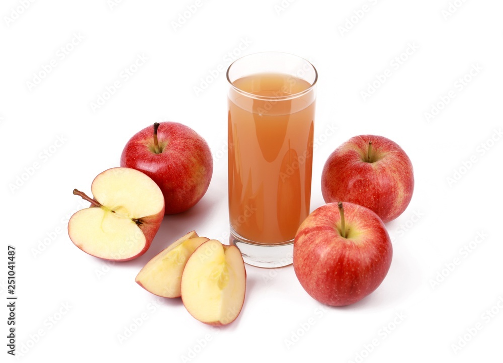 apple juice - sliced red apples and a glass of naturally cloudy apple juice in front of white background apple juice - sliced red apples and a glass of naturally cloudy apple juice in front of white background