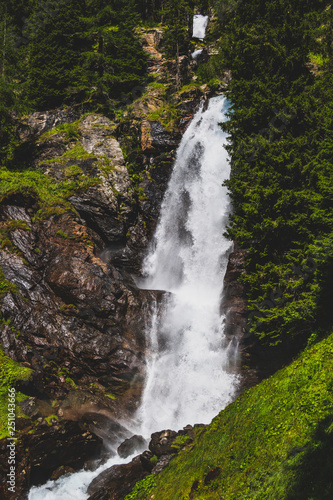 beautiful waterfall in a wood on the Italian Dolomites