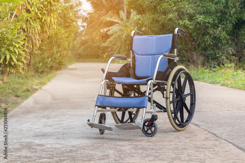 Empty wheelchair for patient or senior or elderly people at the front house,healthy medical concept