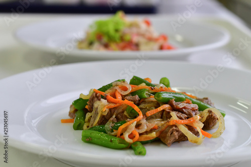 warm salad of beef, green beans and vegetables in the Italian restaurant. the concept of healthy eating, diet