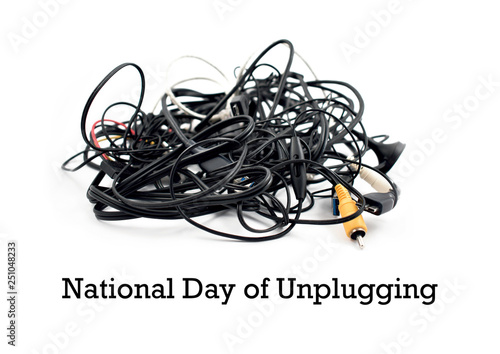 National Day of Unplugging images. Electric power. Digital detox from technology. Tangle of cables on a white background. Plastic electronic waste. Pile of cables and connectors. Important day