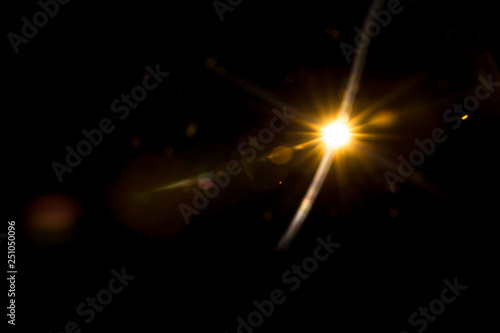 Abstract Natural Sun flare on the black background.